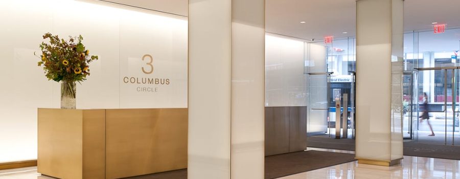 Alternate wide view of the floor to ceiling custom laminated glass wall cladding at 3 Columbus Circle