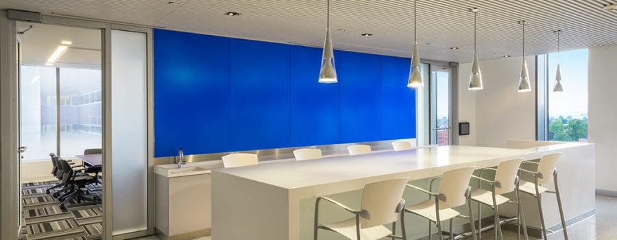 Alternate wide view of the custom laminated glass wall cladding at the Gates Vascular Institute, by Archetype Glass