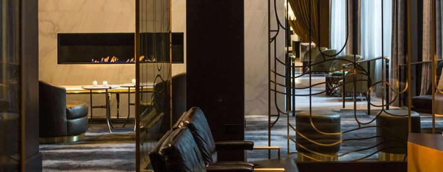 A wide view of the elegant custom art glass partition walls at the Kimpton Hotel Allegro, crafted by Archetype Glass