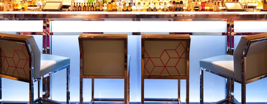Custom glass wall cladding at Hakkasan Restaurant's bar, by Archetype Glass