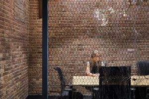 Confidential Chicago Corporate Office custom glass partition walls use Archetype Glass' laminated textured art glass