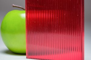 A full banner of the red ribbed custom laminated glass DU-5445, crafted by Archetype Glass for the Q2 2022 QSP