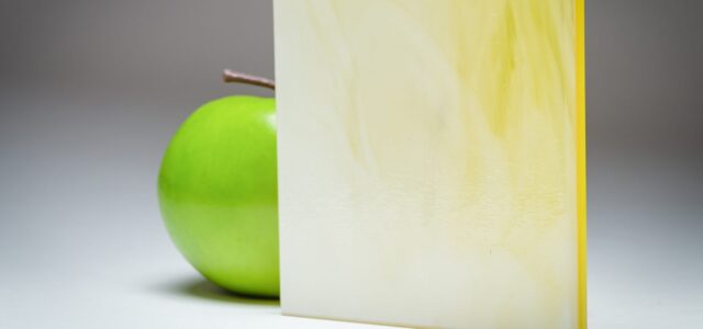 A full banner of the citrus and cream marbled custom laminated glass MX-5315, crafted by Archetype Glass for the Q2 2022 QSP