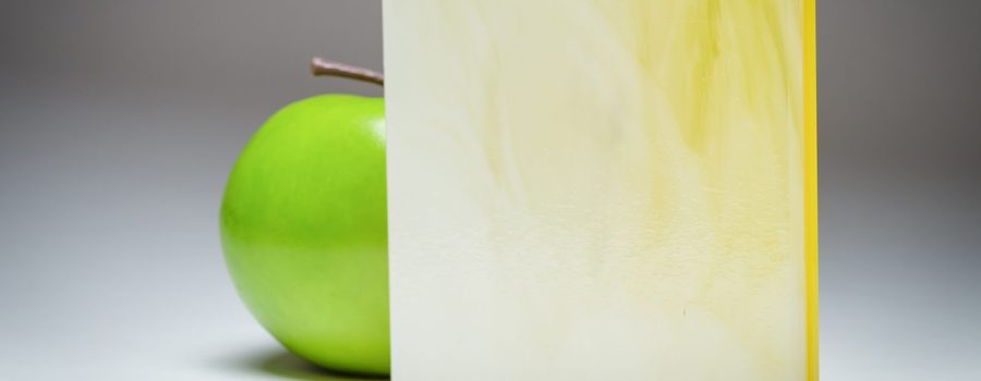 A full banner of the citrus and cream marbled custom laminated glass MX-5315, crafted by Archetype Glass for the Q2 2022 QSP