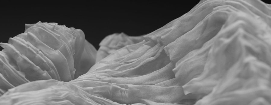 Archetype Glass announces an exclusive collaboration with Spatial Element folded and pleated fabric for its custom laminated glass