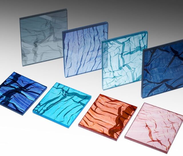 A mosaic of the new custom laminated fabric glass featuring Spatial Element's folded fabric