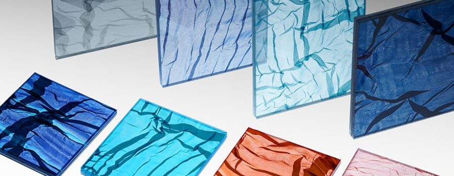 A mosaic of the new custom laminated fabric glass featuring Spatial Element's folded fabric
