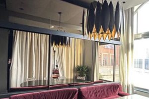 Banner with the Basan Restaurant renovation custom sliding partition walls by Archetype Glass