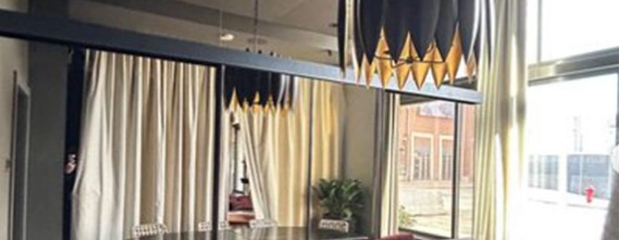 Banner with the Basan Restaurant renovation custom sliding partition walls by Archetype Glass