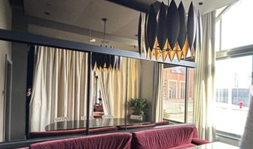 Banner with the Basan Restaurant renovation custom sliding partition walls by Archetype Glass